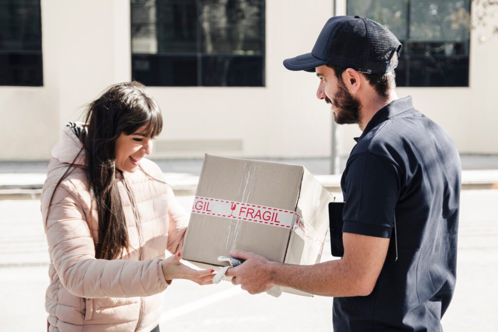 delivery man delivering parcel female customer